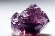 © Marius - A vibrant purple rock against a clean white backdrop