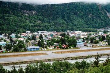 Sticker - Picturesque coastal town is situated along a winding road