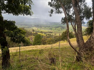 Poster - Hilly landscape with lush green vegetation and majestic mountain peaks in the Victorian Countryside