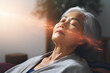Mature Asian enjoying Remote Energy Healing treatment. Connection to higher self, guided meditation, spiritual awakening concept.