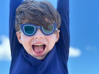 Wall Mural - boy wearing goggles in the beach in south florida cocoa beach 