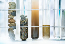 Rock Sample In Geology Science Laboratory Research, Mineral Soil Test In Chemistry Lab Industry Analysis Work, Geological Stone Material From Nature With Scientific Equipment For Industrial Business