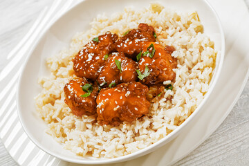 Wall Mural - Baked Honey Sesame Chicken with brown rice