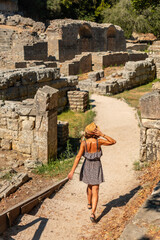 Wall Mural - Woman walking in the archaeological ruins of Butrint or Butrinto National Park in Albania