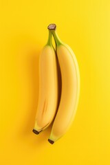 Wall Mural - Banana bunch on yellow background.