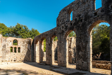 Wall Mural - Arches in the Great Basilica in the archaeological ruins of Butrint or Butrinto National Park in Albania
