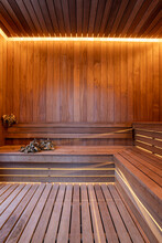 Finnish sauna interior with broom and bucket