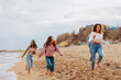 © bernardbodo - Friends walking by the ocean