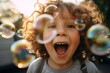 © Yuliia - Joyful happy laughing Caucasian child son 5s kid boy children laugh excited smiling open mouth amazed enjoy playing with air soap bubbles having fun happiness childhood summer vacation family holiday