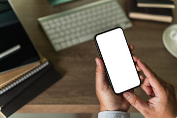 Poster - businessman holding a blank screen smartphone mobile with blank screen blank for your advertising text message communication background workplace job copy space