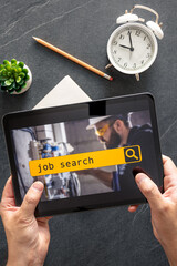Wall Mural - top view of digital tablet with search job on screen in male hands.