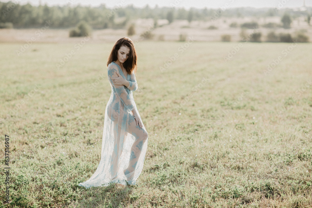 sexy young nude topless girl posing in a field in summer. Added the