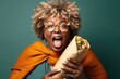 Surprise African Middleaged Woman Holds And Eats Burrito On At The Cinema. Сoncept Surprising Changes For Midleaged Women, The Rise Of African Cuisine Worldwide, Cinema Snacking Habits
