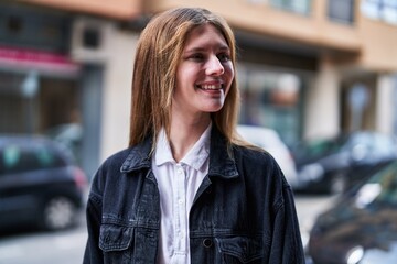 Sticker - Young blonde woman smiling confident looking to the side at street