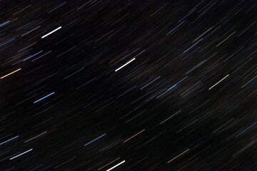 Stars in motion in the night sky.