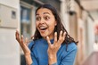 © Krakenimages.com - Young african american woman standing with surprise expression at street