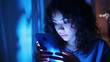 woman is addicted to a phone Sleepy exhausted lying in bed using a smartphone, Insomnia, and addicted. Sad bored in bed scrolling through social networks  at night in the dark