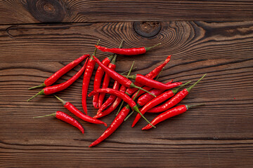 Wall Mural - Red hot chili pepper flat lay. Spicy seasoning background