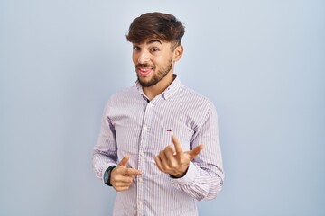 Sticker - Arab man with beard standing over blue background beckoning come here gesture with hand inviting welcoming happy and smiling