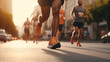 © sawitreelyaon - Close-up feet of group runner running marathon on the road in the urban during rain fall and sunset.