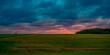 Dramatic stormy sunset hilly roadside landscape on the TranceCanada Highway of Route 2 at Springhill in Prince Edward Island, Canada