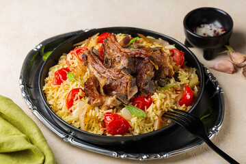 Wall Mural - Plate with slow roasted lamb meat with saffron long rice and vegetables, onion, tomatoes, almond, basil leaves. Haneeth, pilaf, Mansaf, shanks or kabsa. Oriental food, light beige background.