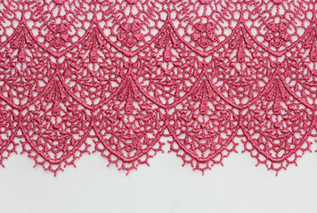 the macro shot of the embroidered textile lace