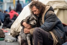 Homeless Person With A Dog In The Street Near Their Tent
