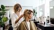 Professional hairdresser doing haircut of woman in beauty salon.