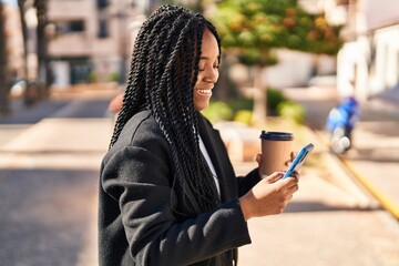 Sticker - African american woman using smartphone drinking coffee at park