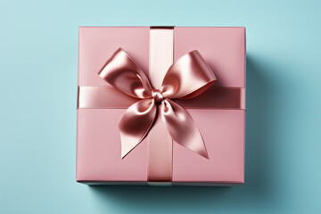 Sticker - Pink gift box with bow on blue background, close up