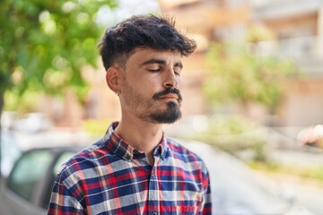 Sticker - Young hispanic man breathing at street