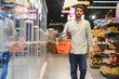 portrait of indian male in grocery with positive attitude