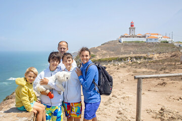 Wall Mural - Family with children, siblings, visiting the most west point of Europe, Cabo Da Roca, during family vacation summertime