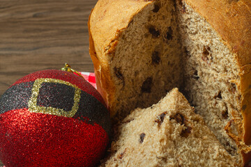 Wall Mural - Slices of panettone and chocottone with Christmas decorations. Selective focus and top view	