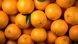  a pile of oranges with a green leaf on top.  generative ai