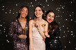 © Prostock-studio - Pretty multiethnic women friends holding photo booth celebrating New Year 2024