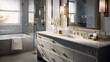 © Lasvu - Grey vanity, gold lighting and fixtures, white marble counter in bathroom.
