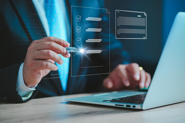 Poster - Business performance checklist, businessman using laptop doing online checklist survey, Businessman using pen to tick correct sign mark in checkbox for quality document control checklist..