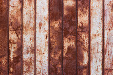 Flat Texture Of Rusty Corrugated Flat Thin Sheet Metal Surface With Vertical Structure And Leftovers Of White Paint