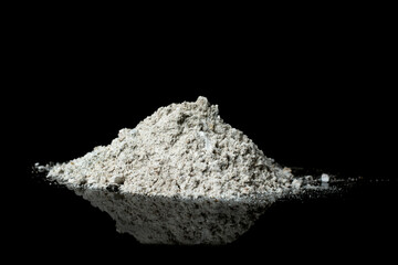 Pile of wood ash isolated on black background.