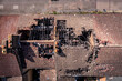 Aerial view directly above the damaged roof of derelict terraced houses after a house fire