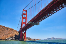 Underside View Of Golden Gate Bridge From Choppy San Francisco Bay Waters