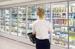 © lado2016 - choosing a dairy products at supermarket.various goods on the supermarket shelves