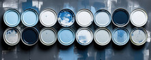 A Painter Juggles Cans Of Blue White And Black Paints Carefully Mixing The Right Amount Of Each To Create A Delicate Hue Of Aged Grey.