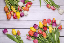 Beautiful Colorful Tulip Flowers On White Wooden Table, Flat Lay. Space For Text