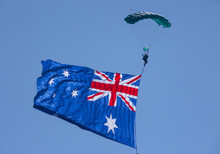 A Skydiver Displaying The An Australian Flag Banner At The Opening Of An Airshow On The Gold Coast Of Australia.