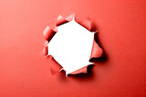 Fototapeta  - 穴の空いた赤い紙の背景テクスチャー