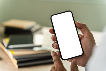 Poster - businessman holding a blank screen smartphone mobile with blank screen blank for your advertising text message communication background workplace job copy space