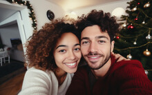 Multiracial Young Couple Or Family Taking Selfies On Christmas At Home In Modern Apartment